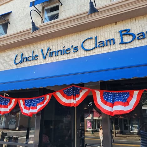 Uncle Vinnie's Clam Bar storefront decorated for the holiday.